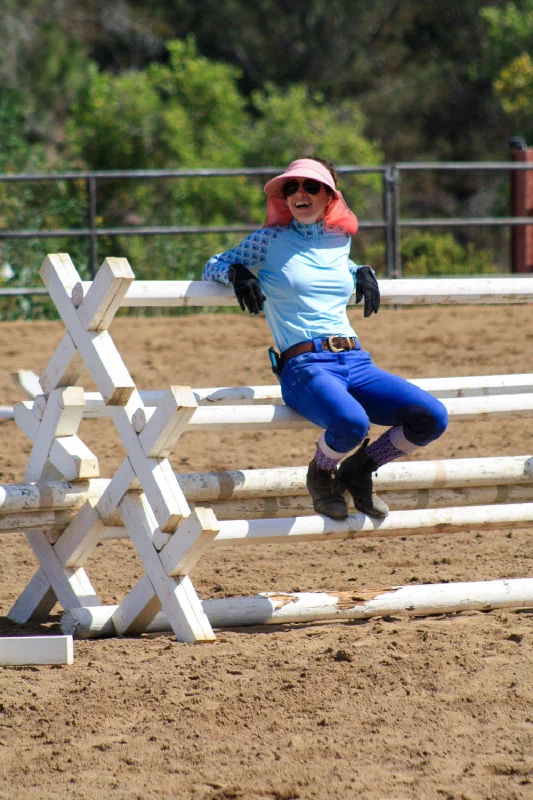 Lauren Salas sitting on a jump, smiling
